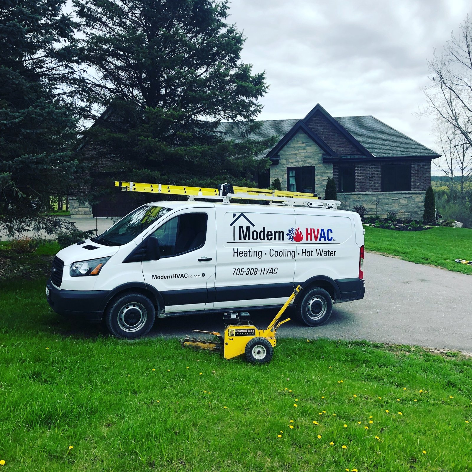 Modern HVAC truck and company-owned trenching equipment
