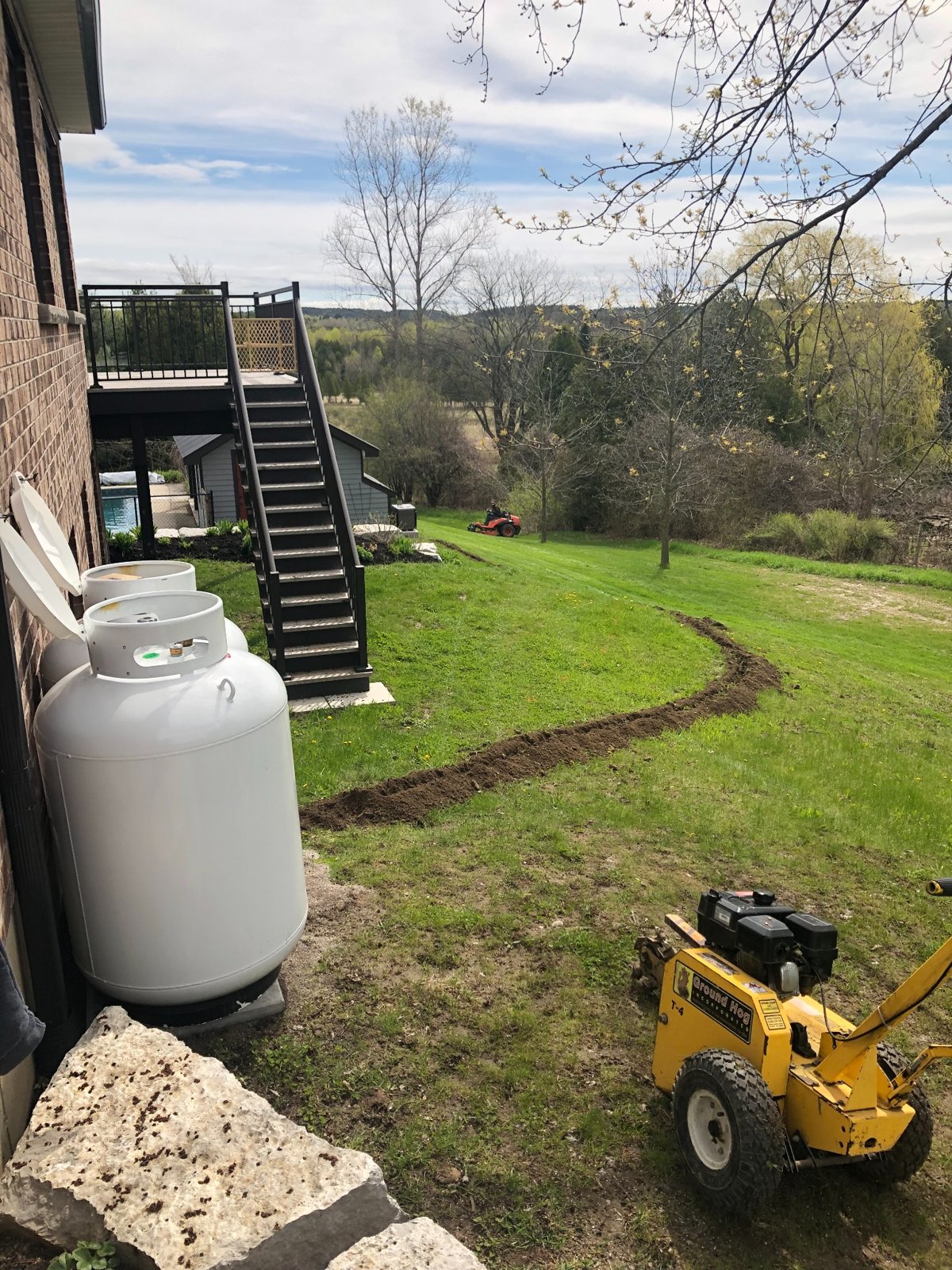 Propane tanks and underground gas-line trench