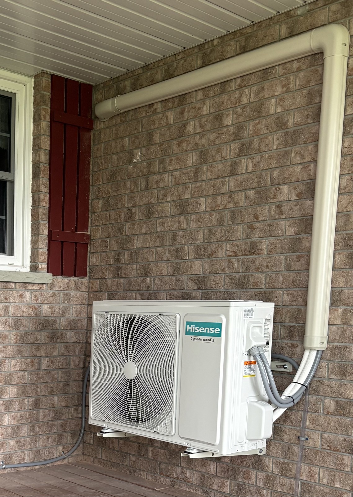 Ductless installation with finished exterior line-hide and capping